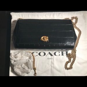 Coach Alexa turn lock clutch